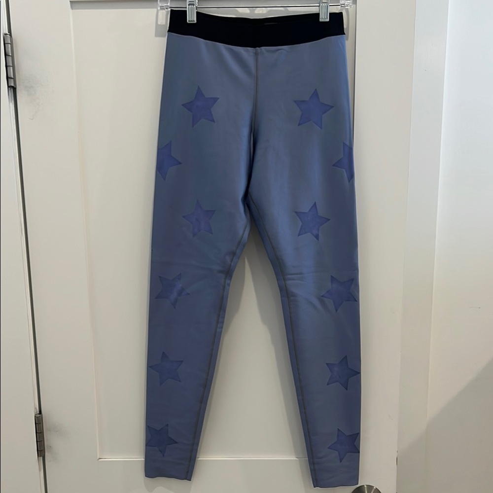Ultracor Star Patterned Leggings in women’s size Large. Color is lavender